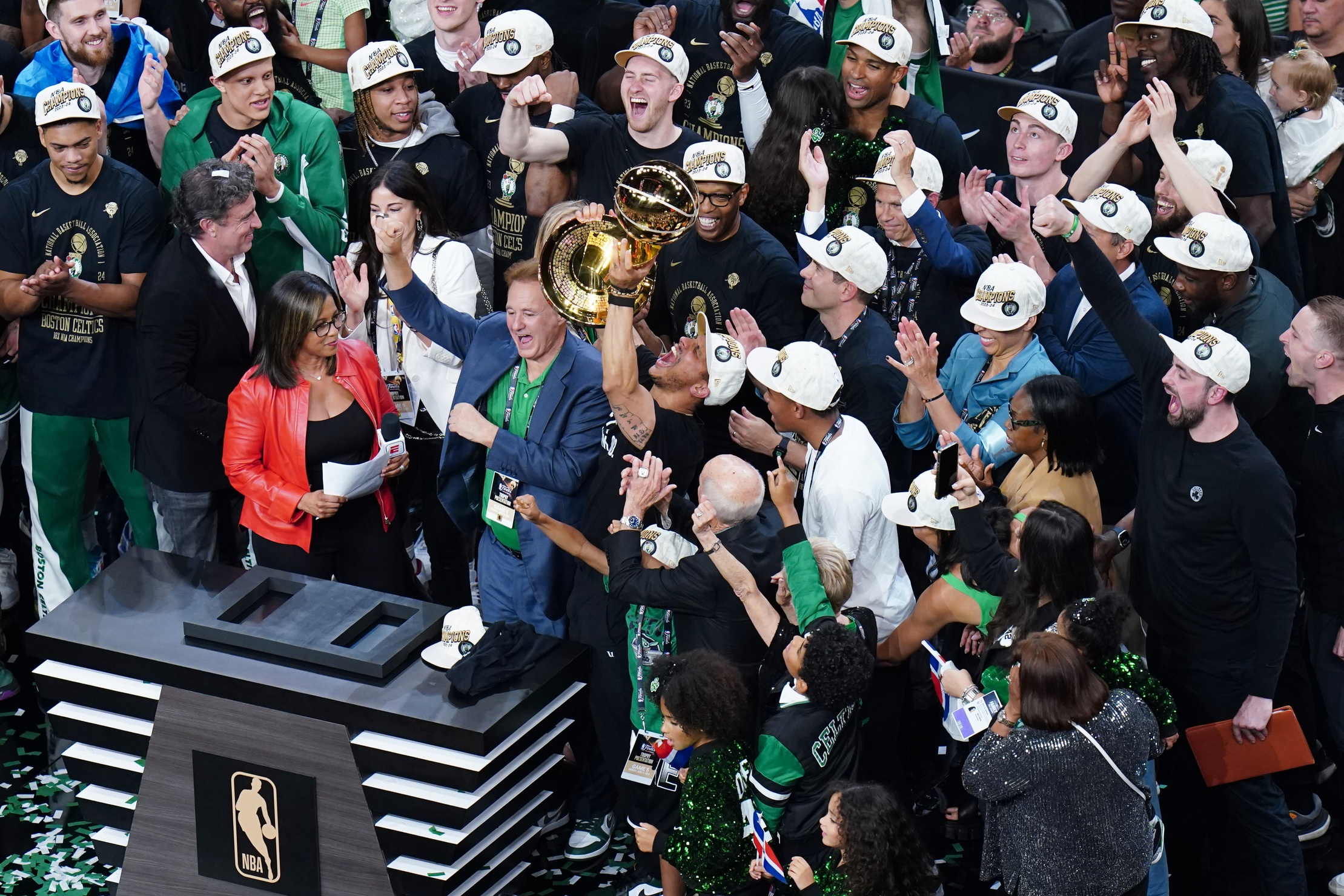 Boston Celtics head coach Joe Mazzulla celebrates with the trophy