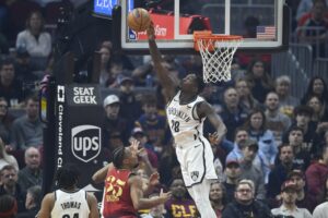 Brooklyn Nets forward Dorian Finney-Smith (28) blocks a shot by Cleveland Cavaliers forward Isaac Okoro (35)