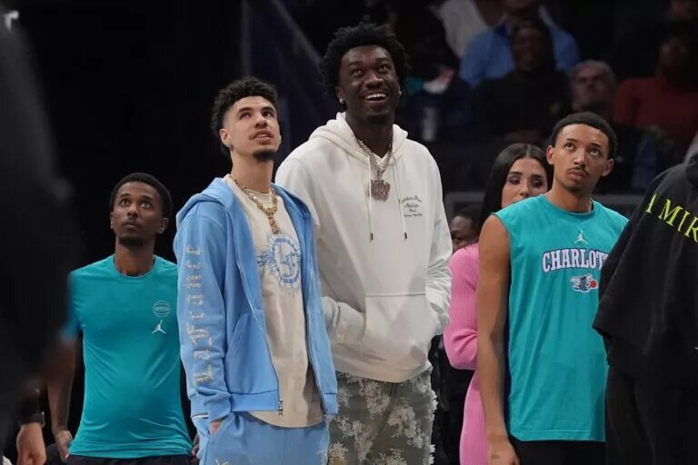 Charlotte Hornets guard LaMelo Ball (1) and center Mark Williams (5) in street clothes