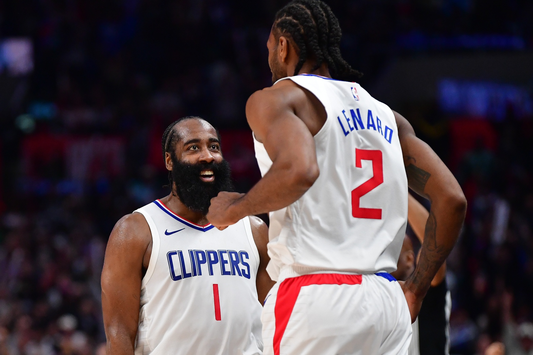 Los Angeles Clippers guard James Harden (1) reacts after forward Kawhi Leonard (2) scores three point basket