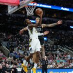 Indiana Pacers guard Bennedict Mathurin (00) shoots in front of San Antonio Spurs forward Jeremy Sochan (10)