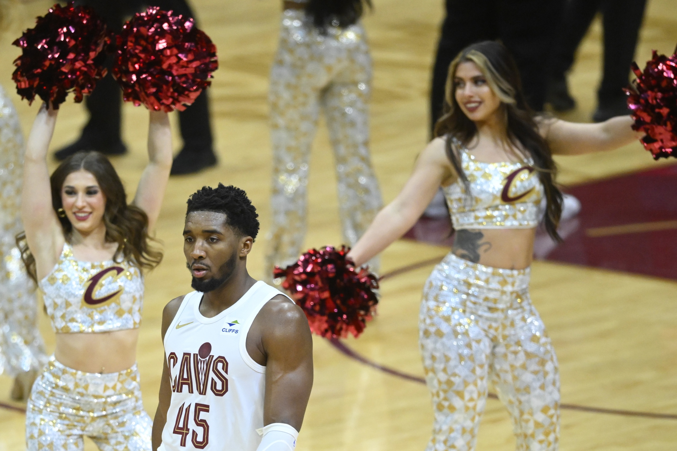 Cleveland Cavaliers guard Donovan Mitchell (45) walks past the Cavaliers dance team