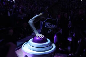 Sacramento Kings guard Keon Ellis (23) presses the button to light the beam