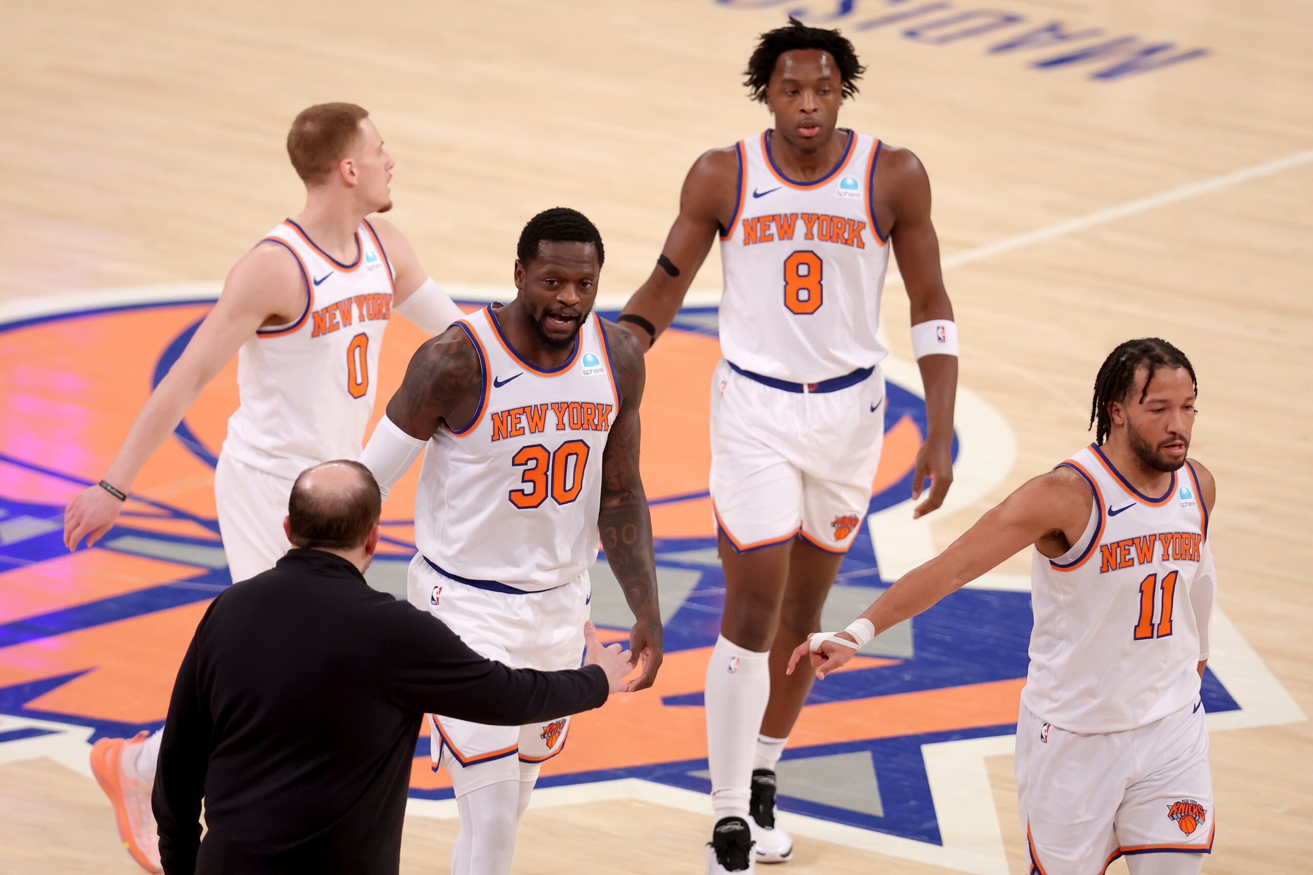 New York Knicks head coach Tom Thibodeau high fives New York Knicks forward Julius Randle (30) with guard Donte DiVincenzo (0) and forward OG Anunoby (8) and guard Jalen Brunson (11) during the first quarter against the Washington Wizards at Madison Square Garden.