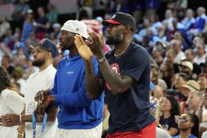 LeBron James cheers in the second half between France and the United States in the women's gold medal game during the Paris 2024 Olympic Summer Games at Accor Arena.