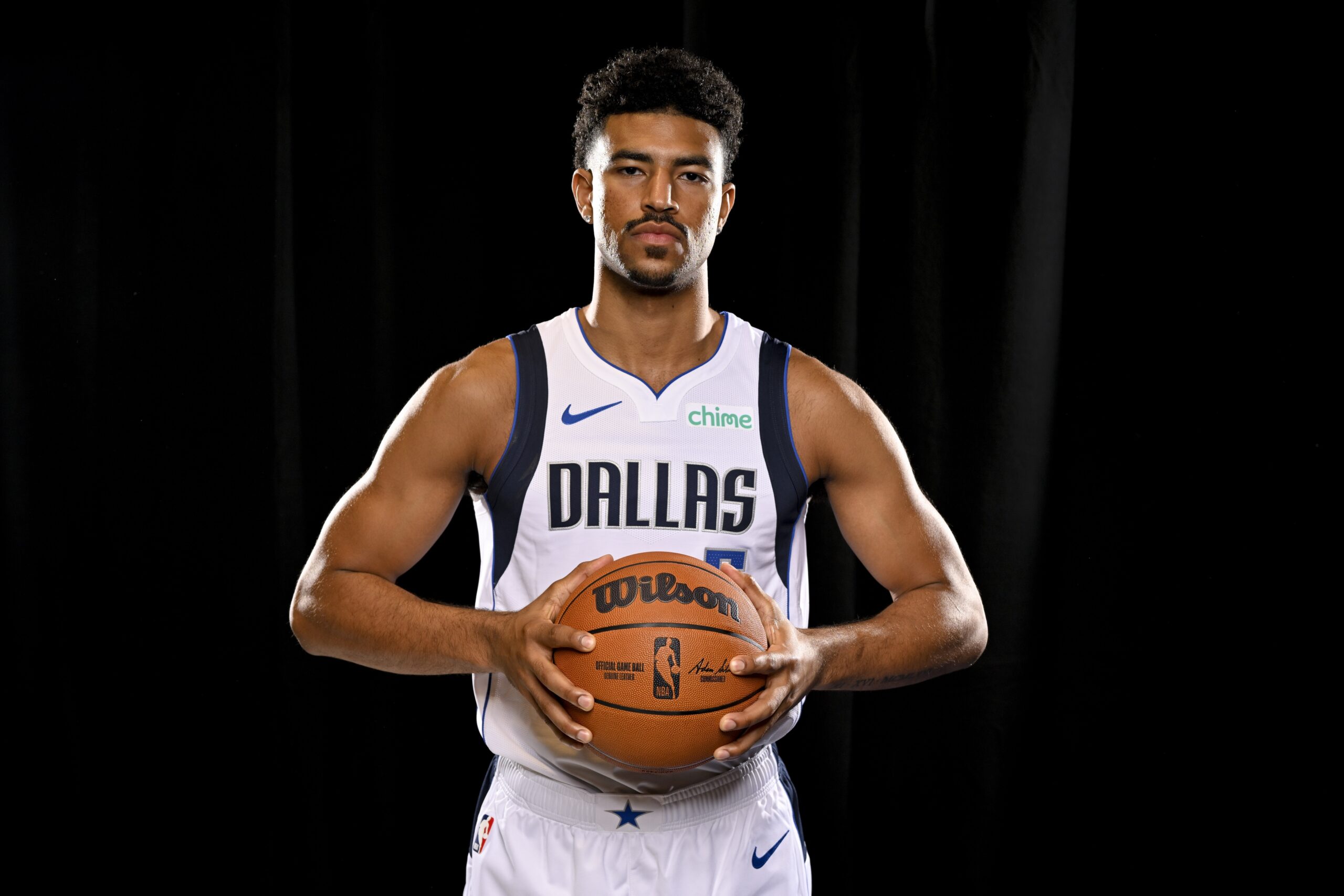 Dallas Mavericks guard Quentin Grimes (5) poses for a photo during the 2024 Dallas Mavericks media day