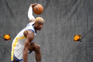 Golden State Warriors forward Jonathan Kuminga (00) dribbles the ball during Media Day