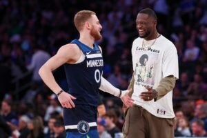 Minnesota Timberwolves guard Donte DiVincenzo (0) celebrates with forward Julius Randle (30)