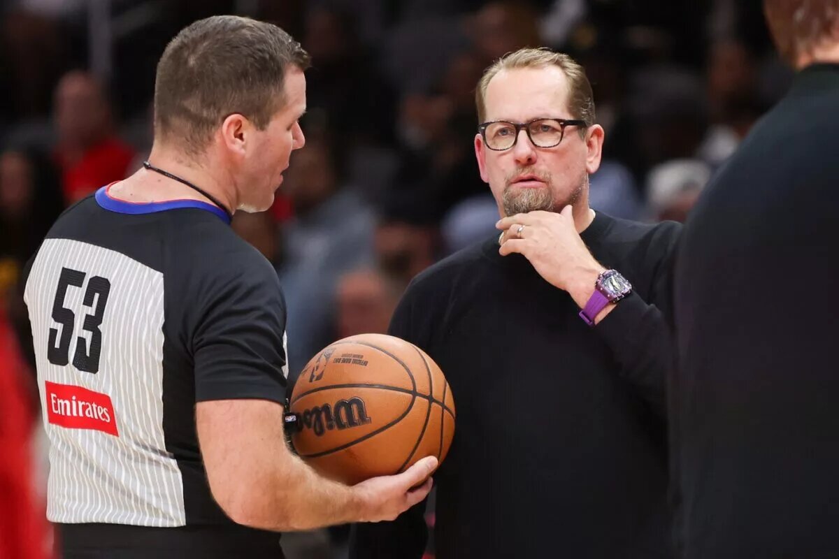 Philadelphia 76ers head coach Nick Nurse talks to referee