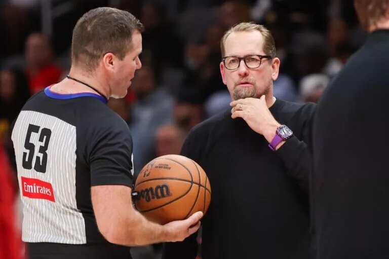 Philadelphia 76ers head coach Nick Nurse talks to referee