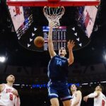 Memphis Grizzlies center Zach Edey (14) dunks