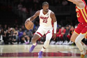 Miami Heat forward Jimmy Butler (22) brings the ball up the court