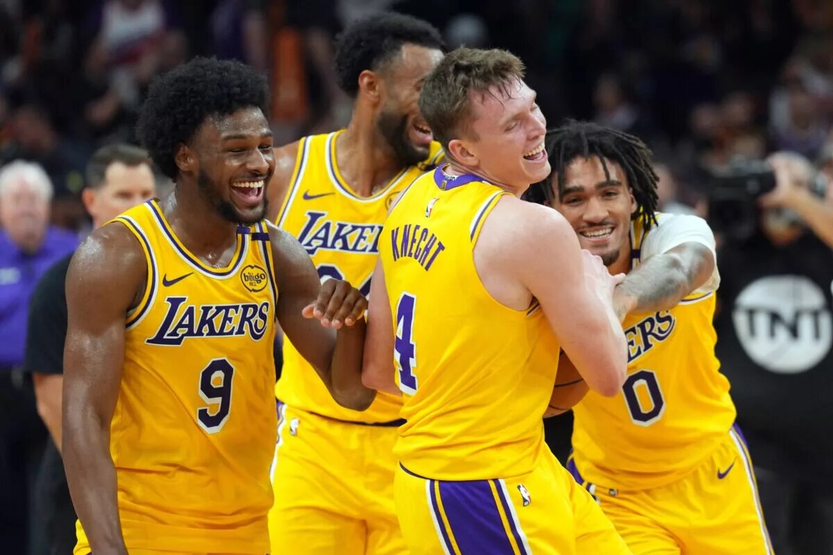 Los Angeles Lakers guard Bronny James (9) and Los Angeles Lakers guard Dalton Knecht (4) and Los Angeles Lakers guard Jalen Hood-Schifino (0) celebrate after defeating the Phoenix Suns
