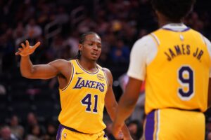 Los Angeles Lakers guard Quincy Olivari (41) gives a high five to guard Bronny James (9) after a play against the Golden State Warriors