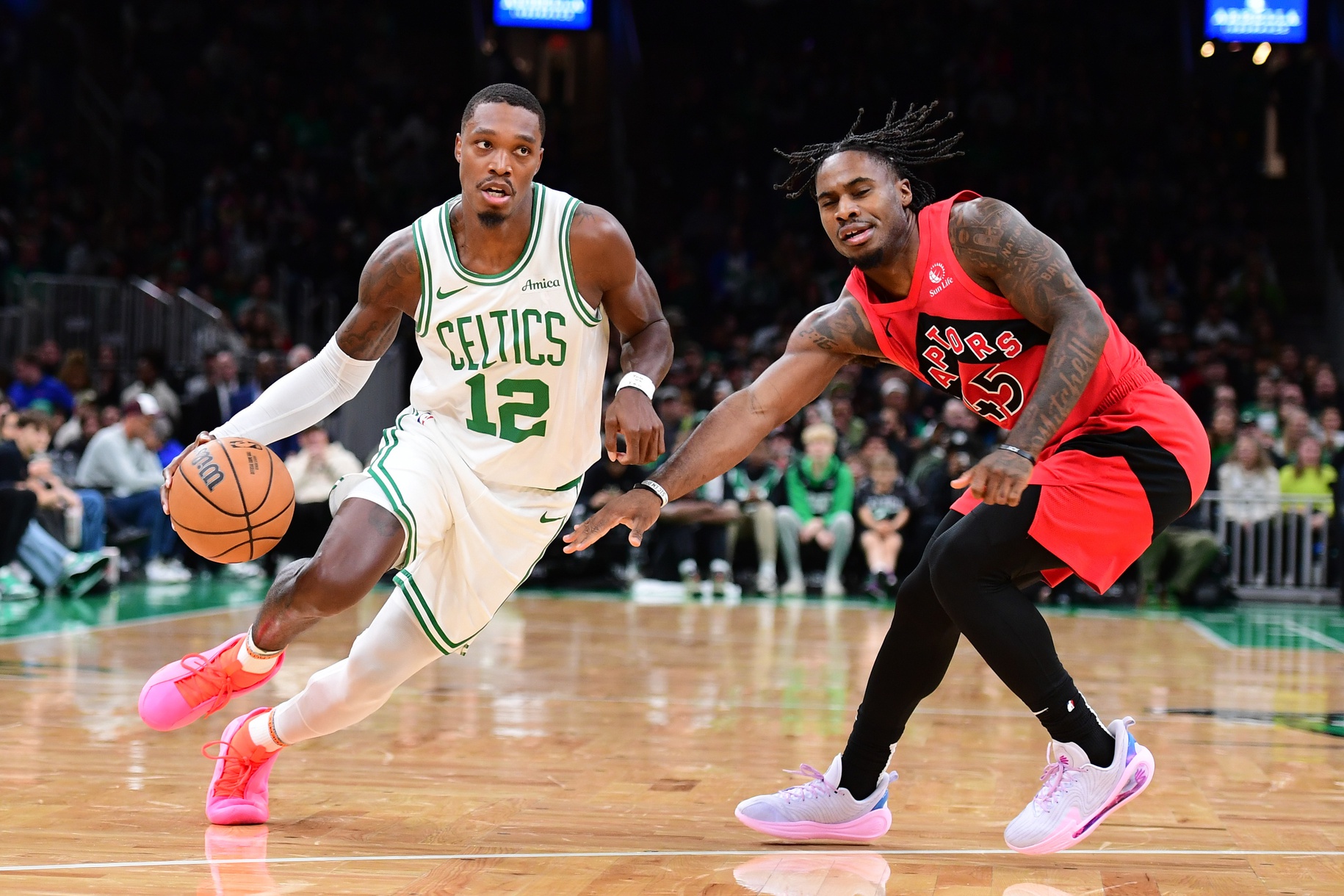 Boston Celtics guard Lonnie Walker IV (12) controls the ball