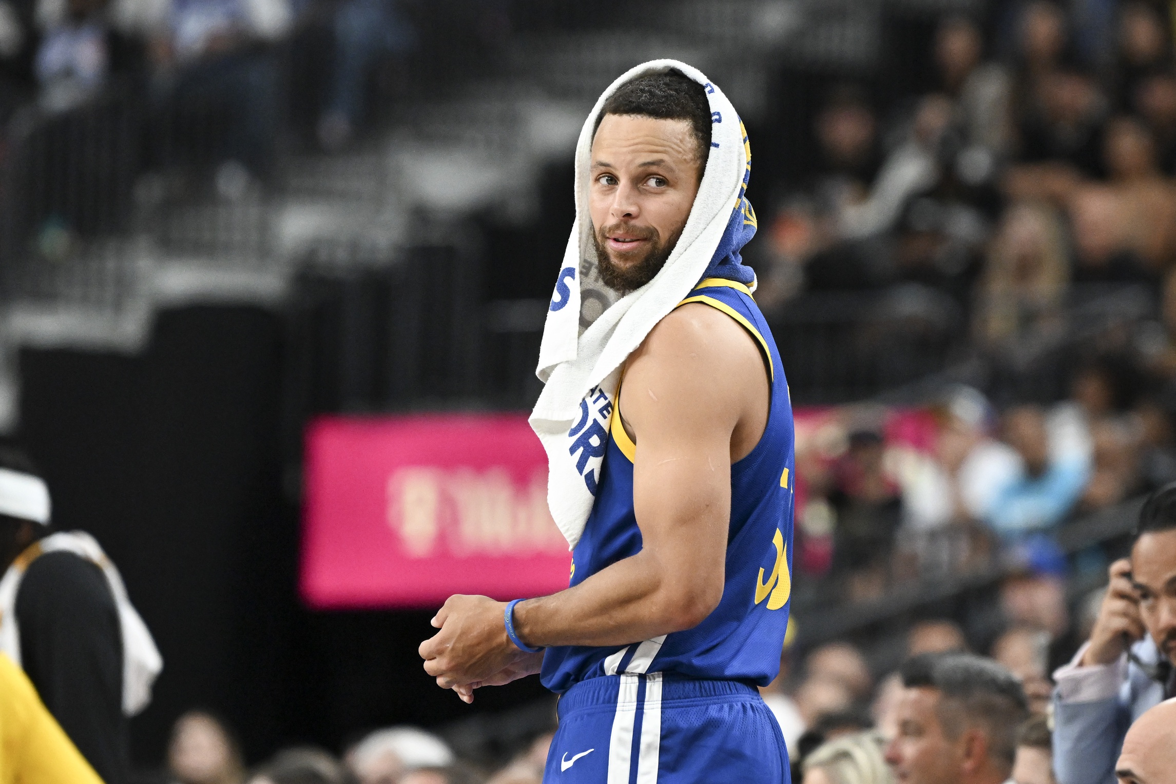 Golden State Warriors guard Stephen Curry (30) looks on from the bench