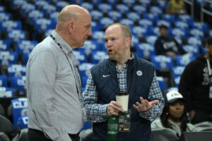 Los Angeles Clippers owner Steve Ballmer, left, talks with Lawrence Frank