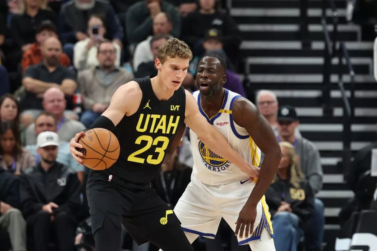 Utah Jazz forward Lauri Markkanen (23) posts up on Golden State Warriors forward Draymond Green (23)