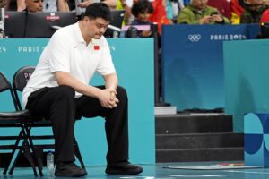 Former Houston Rockets star and China Basketball Association president Yao Ming looks on during the game between China