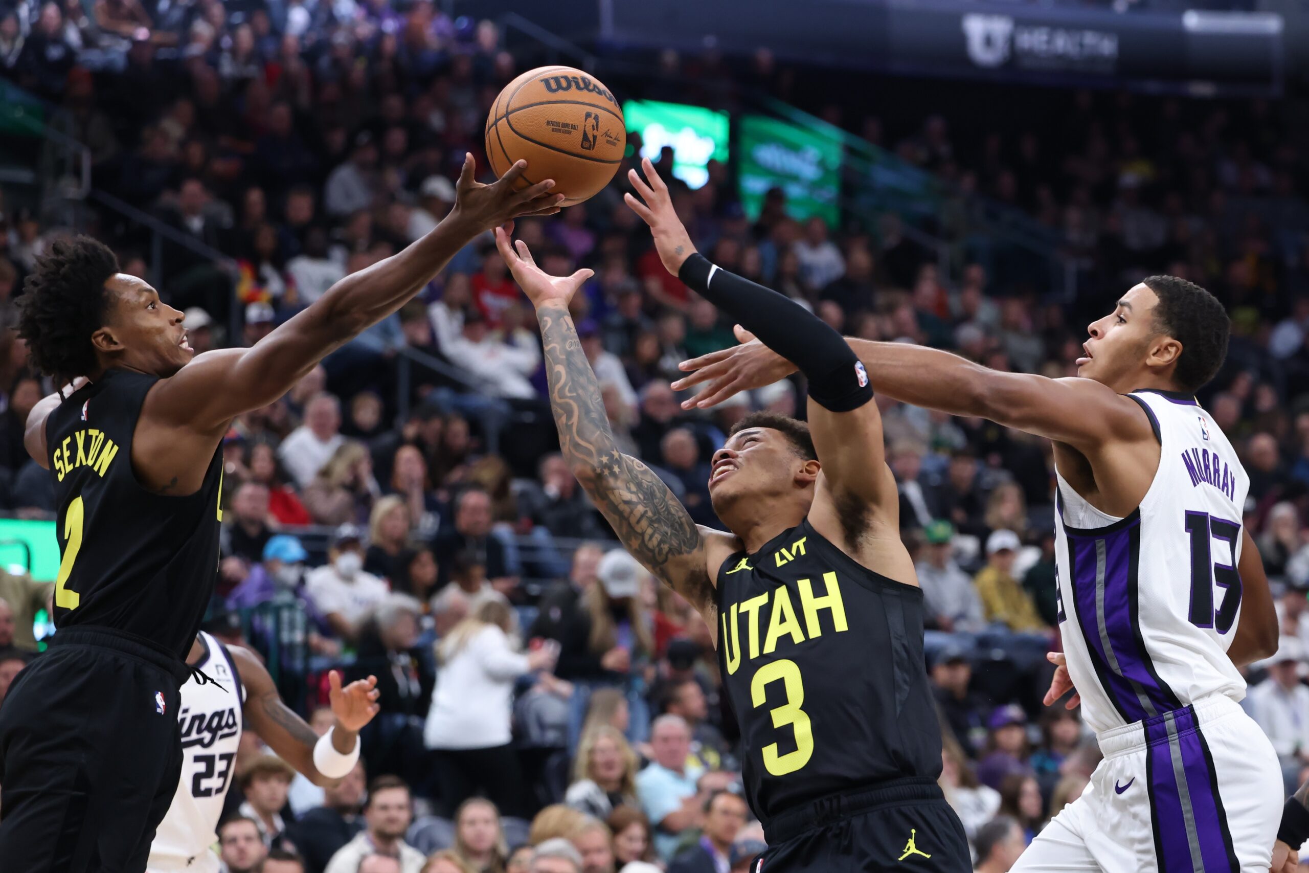 Utah Jazz guard Collin Sexton (2) and guard Keyonte George (3) battle for a rebound