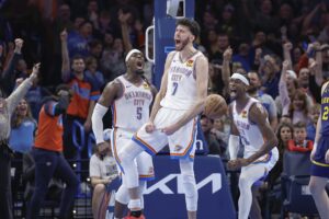 Dec 8, 2023; Oklahoma City, Oklahoma, USA; Oklahoma City Thunder forward Chet Holmgren (7), guard Luguentz Dort (5) and guard Shai Gilgeous-Alexander (2) celebrate after Chet Holmgren scores a basket against the Golden State Warriors during the second half at Paycom Center. Mandatory Credit: Alonzo Adams-USA TODAY Sports