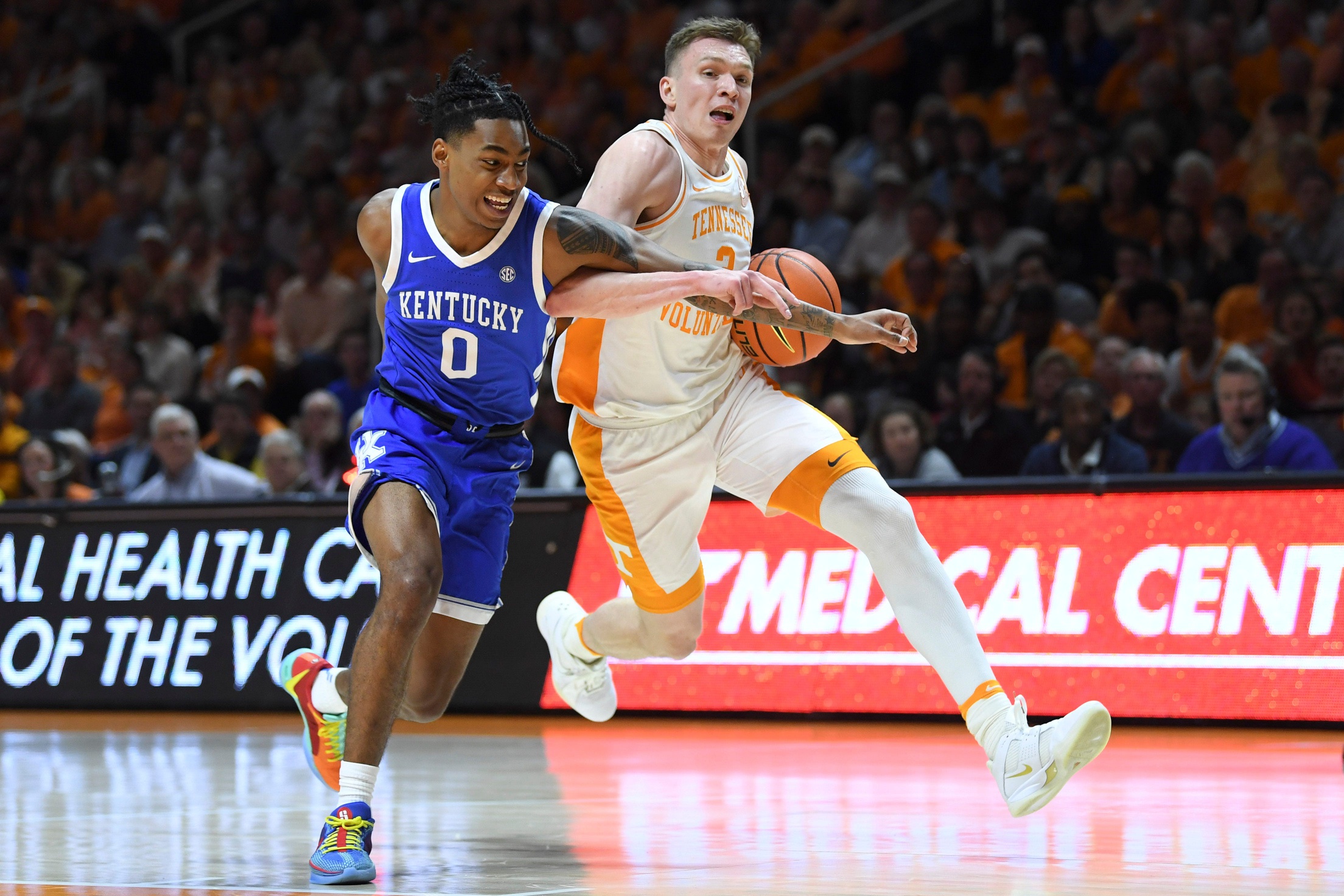 Tennessee guard Dalton Knecht (3) defended by Kentucky guard Rob Dillingham (0) during an NCAA college basketball game between Tennessee and Kentucky in Knoxville, Tenn., Saturday, March 9, 2024.