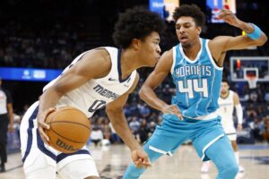 Oct 10, 2024; Memphis, Tennessee, USA; Memphis Grizzlies forward Jaylen Wells (0) drives to the basket as Charlotte Hornets guard Charlie Brown Jr. (44) defends during the second half at FedExForum. Mandatory Credit: Petre Thomas-Imagn Images