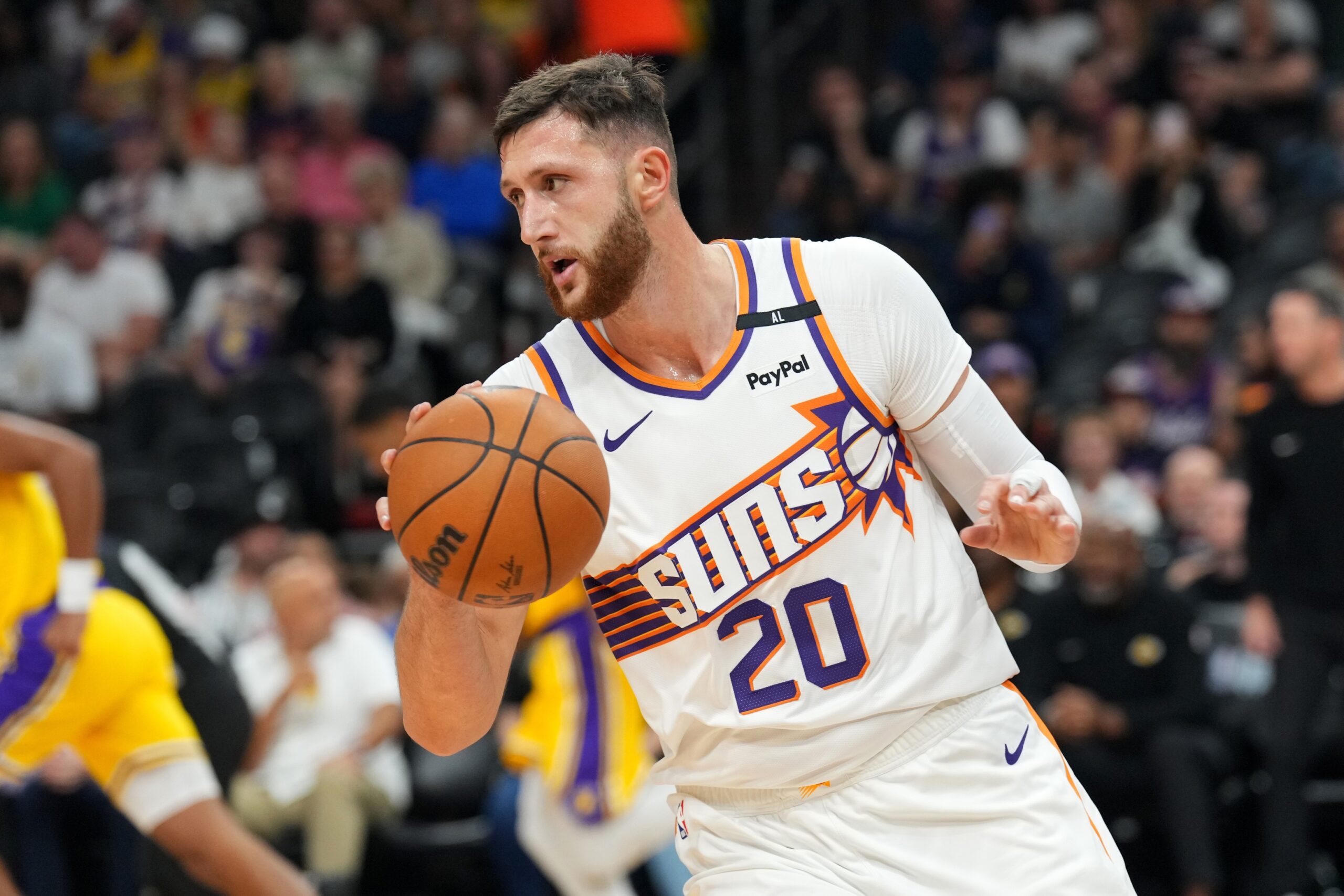 Phoenix Suns center Jusuf Nurkic (20) dribbles against the Los Angeles Lakers during the first half at Footprint Center.