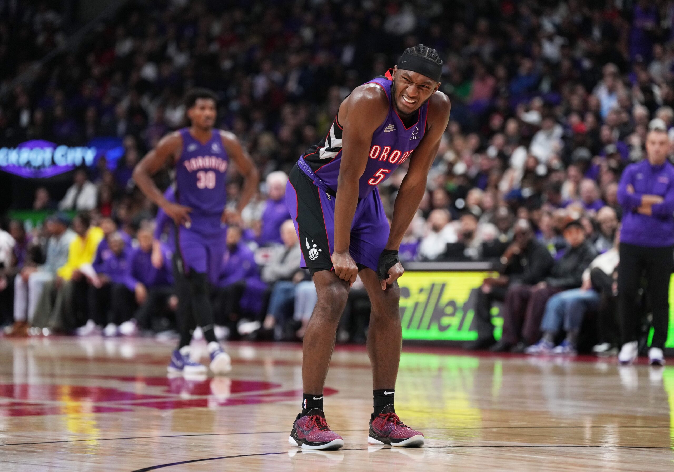 Toronto Raptors guard Immanuel Quickley (5) reacts after falling against the Cleveland Cavaliers during the second quarter at Scotiabank Arena.