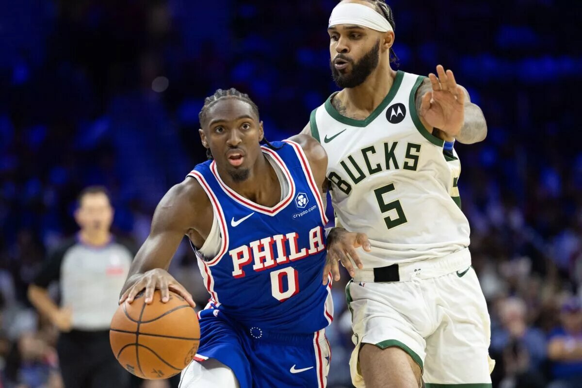Oct 23, 2024; Philadelphia, Pennsylvania, USA; Philadelphia 76ers guard Tyrese Maxey (0) drives past Milwaukee Bucks guard Gary Trent Jr. (5) during the fourth quarter at Wells Fargo Center. Mandatory Credit: Bill Streicher-Imagn Images