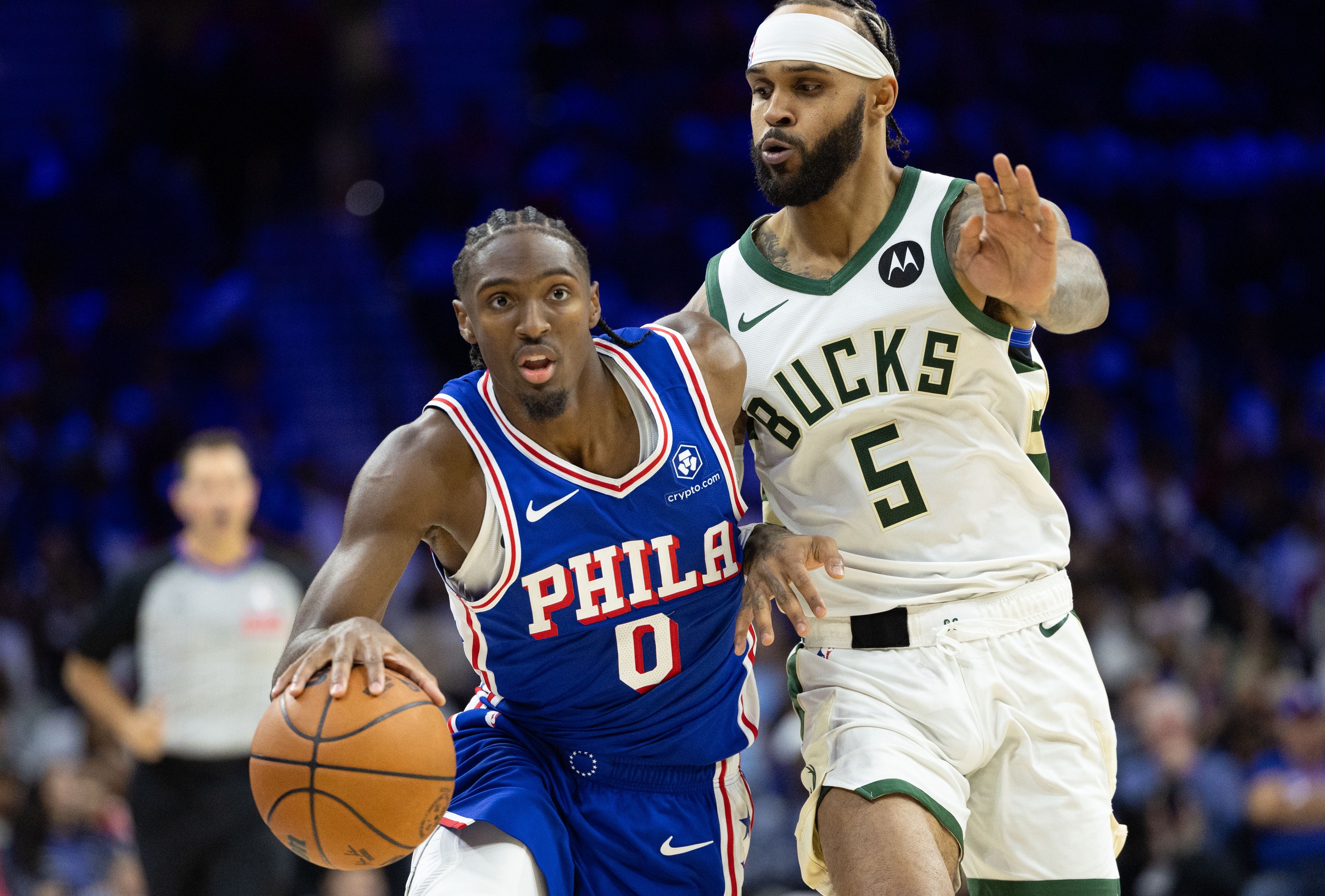 Oct 23, 2024; Philadelphia, Pennsylvania, USA; Philadelphia 76ers guard Tyrese Maxey (0) drives past Milwaukee Bucks guard Gary Trent Jr. (5) during the fourth quarter at Wells Fargo Center. Mandatory Credit: Bill Streicher-Imagn Images