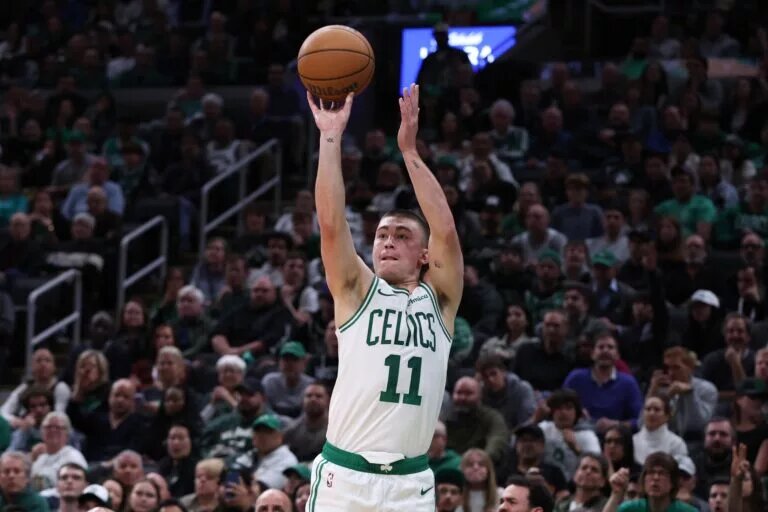 Boston Celtics guard Payton Pritchard (11) shoots during the second half against the Milwaukee Bucks at TD Garden.