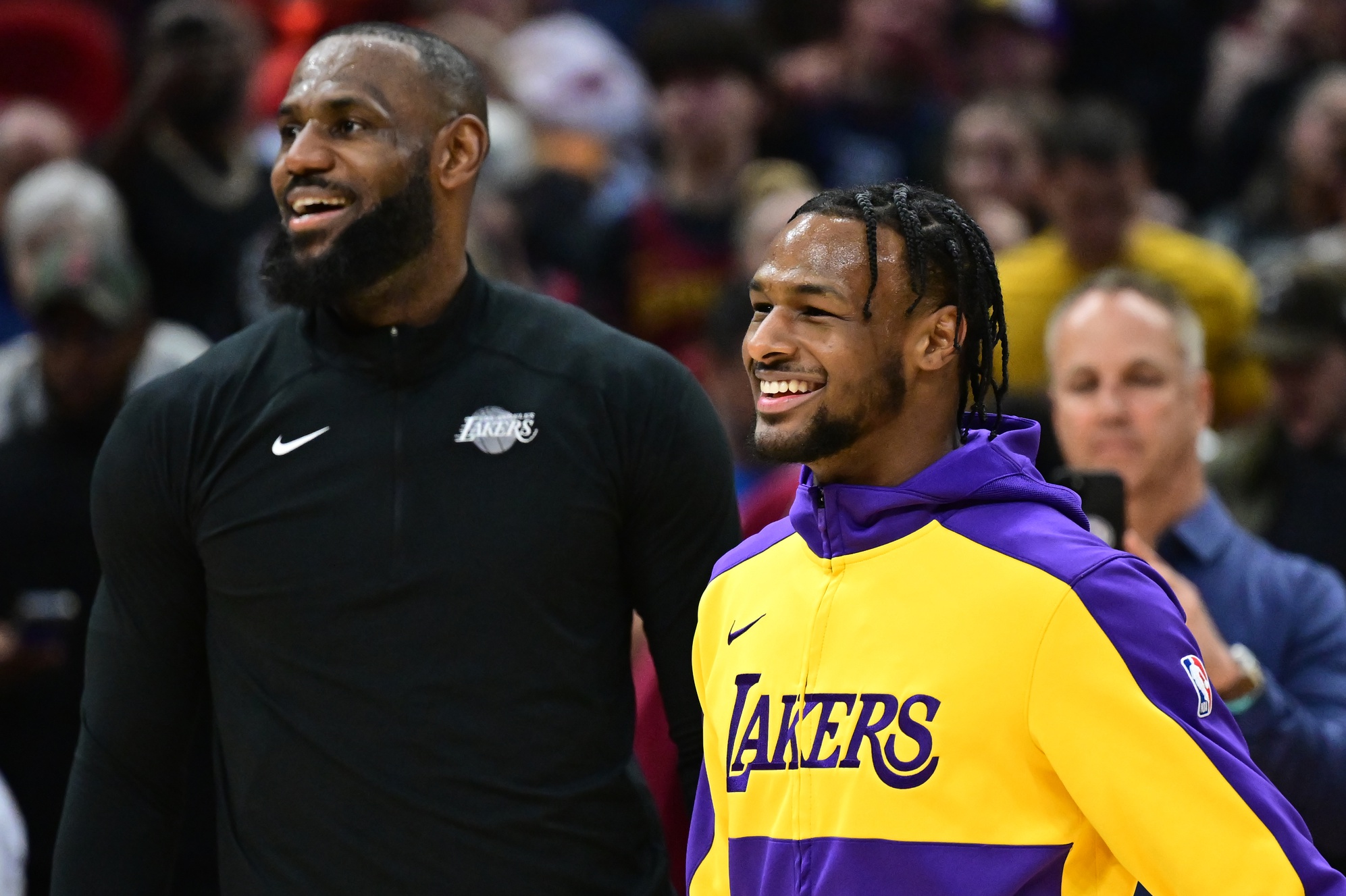 Los Angeles Lakers guard Bronny James, right, and forward LeBron James warm up