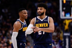 Denver Nuggets guard Jamal Murray (27) gestures in front of guard Russell Westbrook (4)