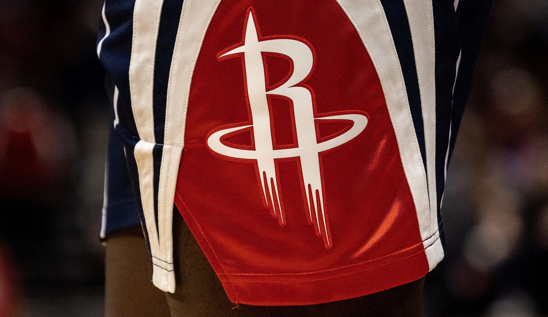 A detail of the Houston Rockets logo on the side of Houston Rockets jersey shorts