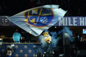 Denver Nuggets mascot Rocky waves flag before game