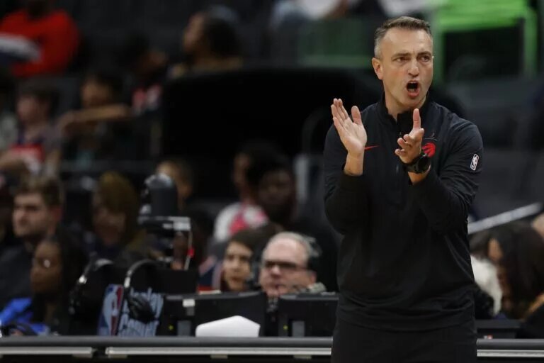 Toronto Raptors head coach Darko Rajakovic encourages his team from the sideline