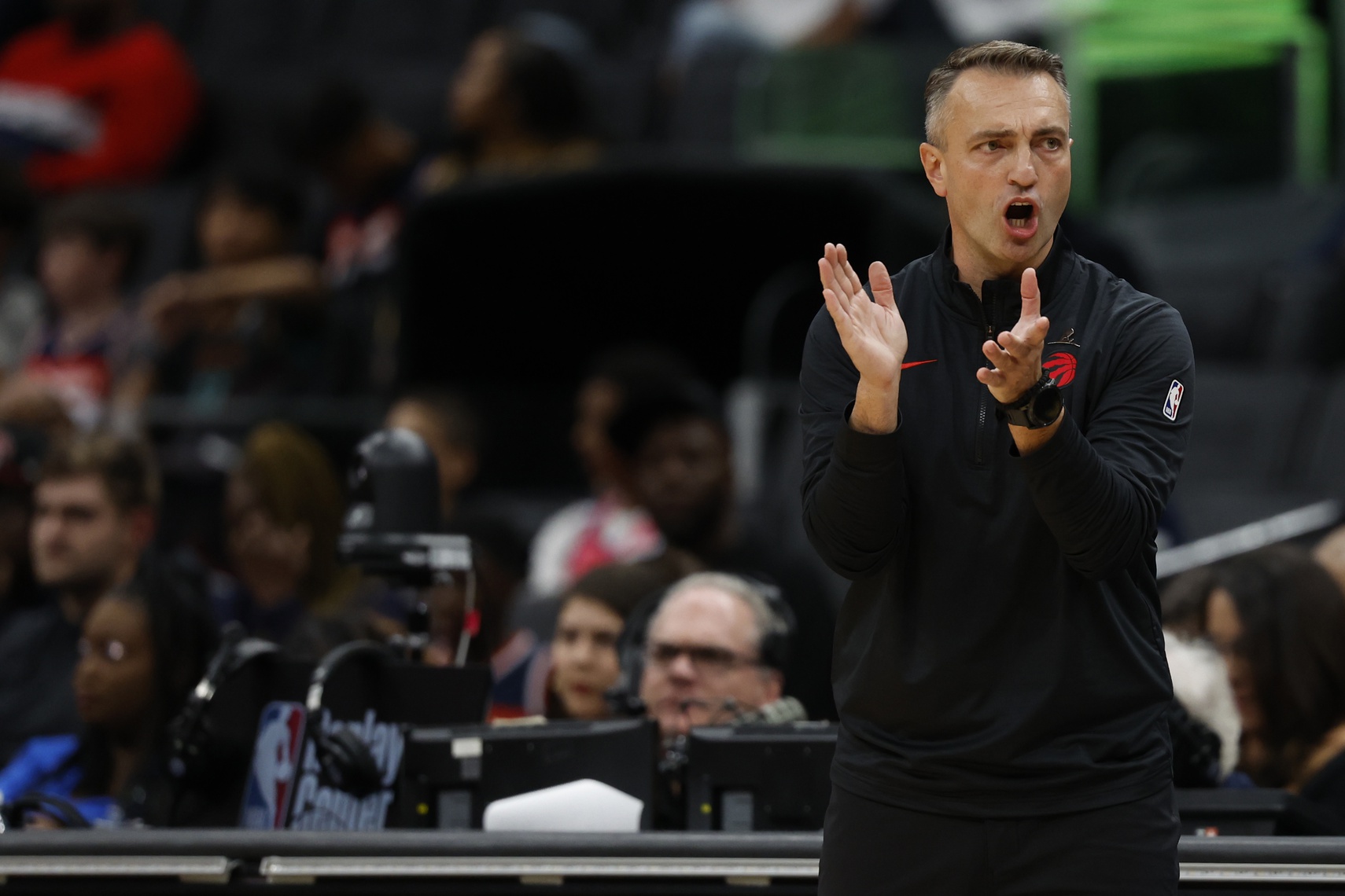 Toronto Raptors head coach Darko Rajakovic encourages his team from the sideline