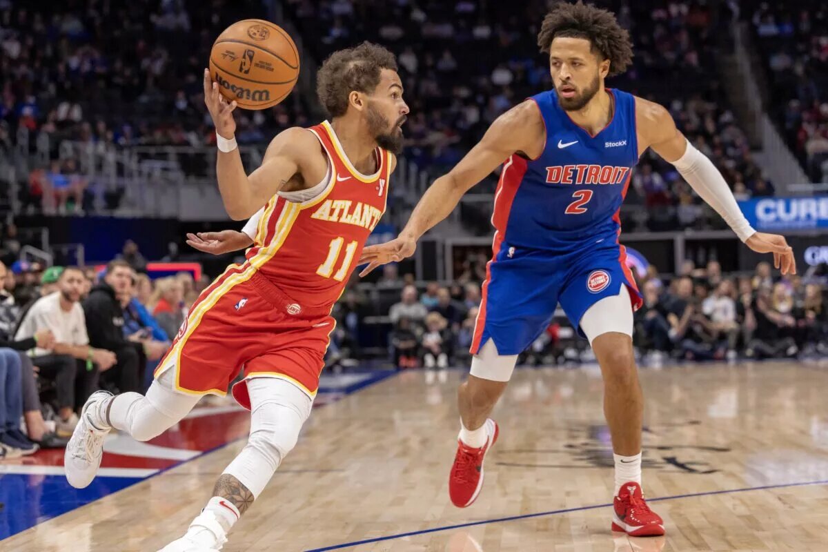 Atlanta Hawks guard Trae Young (11) moves the ball up court