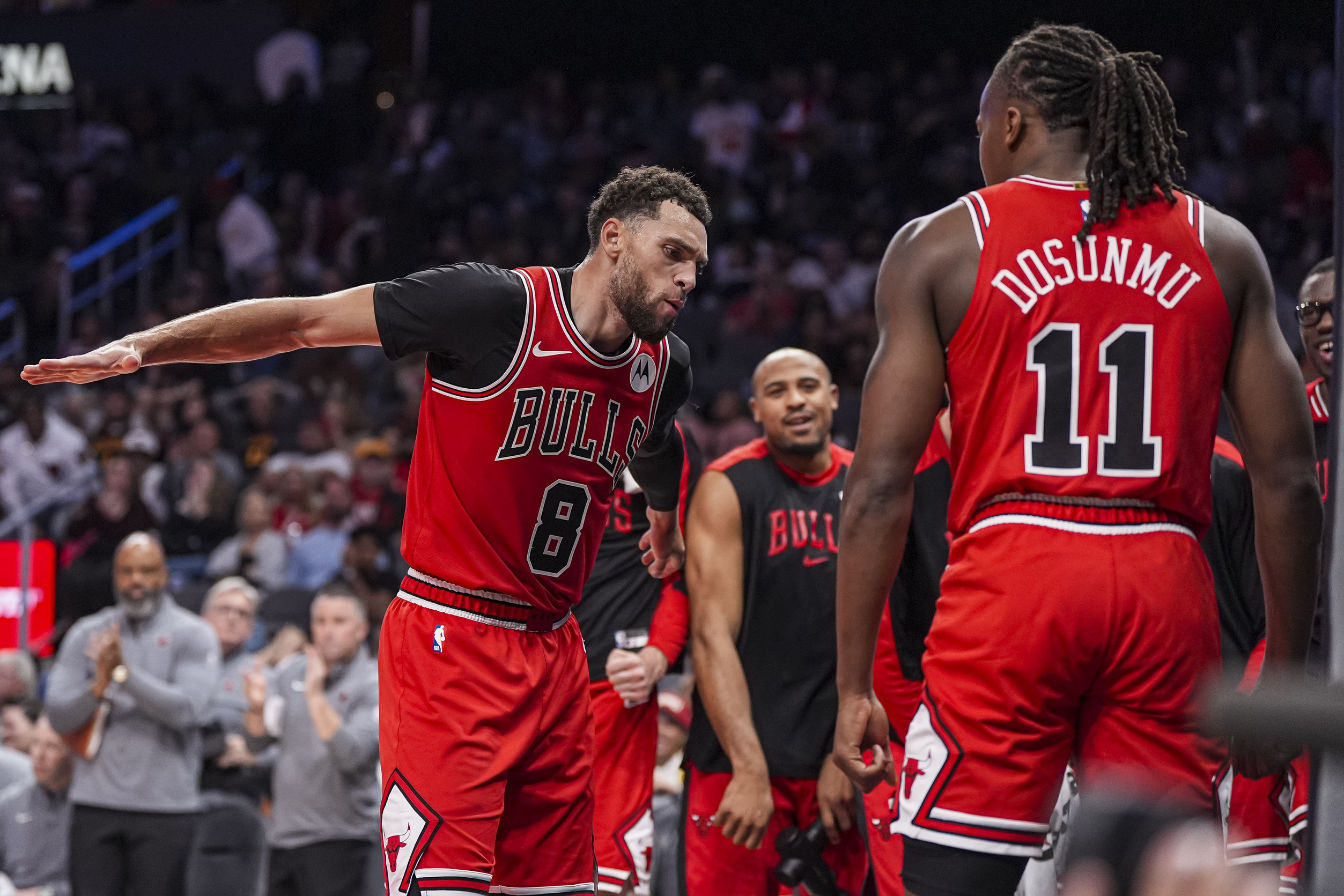 Chicago Bulls guard Zach LaVine (8) reacts after teammate Ayo Dosunmu (11) scored