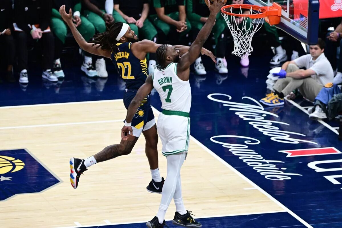 Boston Celtics wing Jaylen Brown (7) goes up for dunk