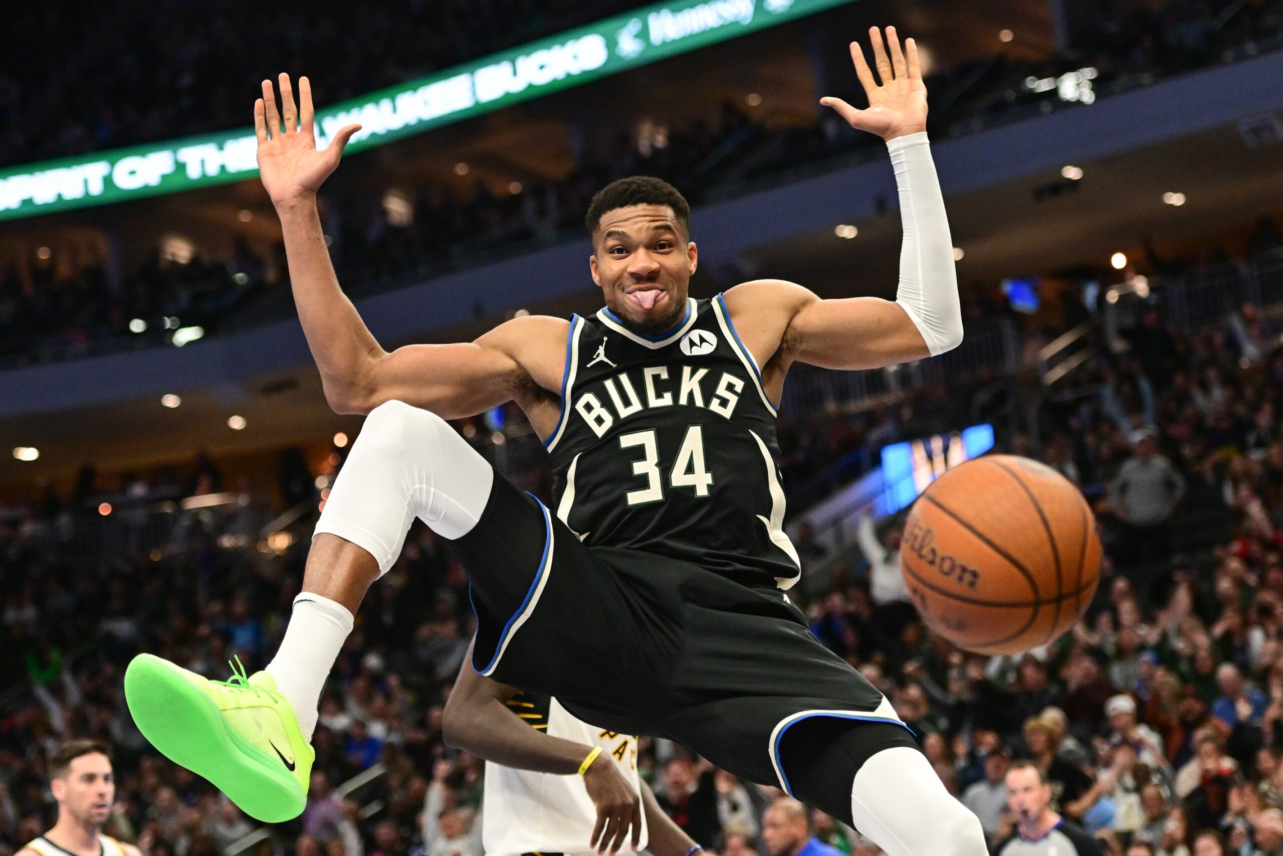 Milwaukee Bucks forward Giannis Antetokounmpo (34) sticks tongue out after dunking