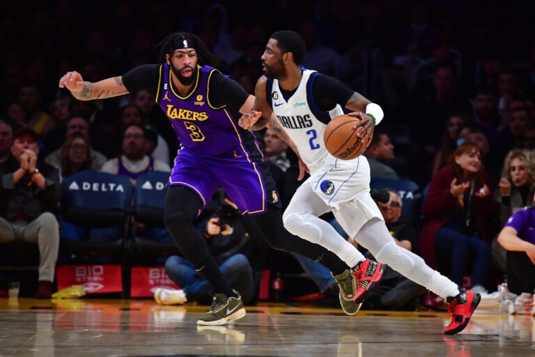 Dallas Mavericks guard Kyrie Irving (2) moves the ball against Los Angeles Lakers big Anthony Davis (3)