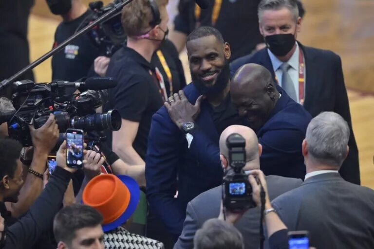 LeBron James and Michael Jordan on court during halftime