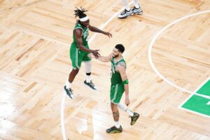 Boston Celtics Jayson Tatum with Jrue Holiday