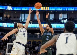 Villanova Wildcats guard Mark Armstrong shoots a jump shot over Marquette Golden Eagles guard Stevie Mitchell (4) during the second half of their game Monday, Jan. 15, 2024, at Fiserv Forum in Milwaukee. The Marquette Golden Eagles defeated Villanova Wildcats 87-74.