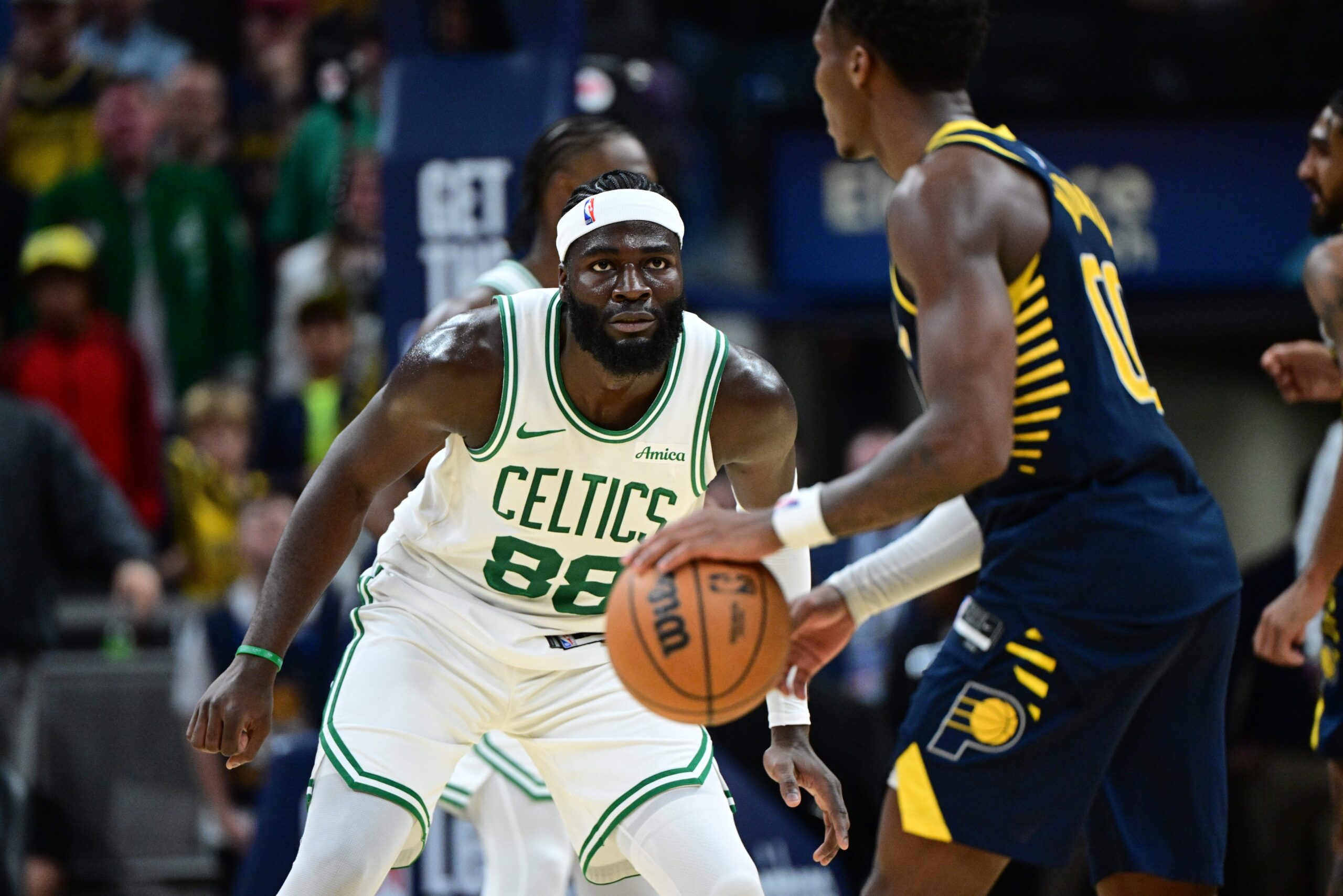 Oct 30, 2024; Indianapolis, Indiana, USA; Boston Celtics center Neemias Queta (88) covers Indiana Pacers guard Bennedict Mathurin (00) during overtime at Gainbridge Fieldhouse. Mandatory Credit: Marc Lebryk-Imagn Images