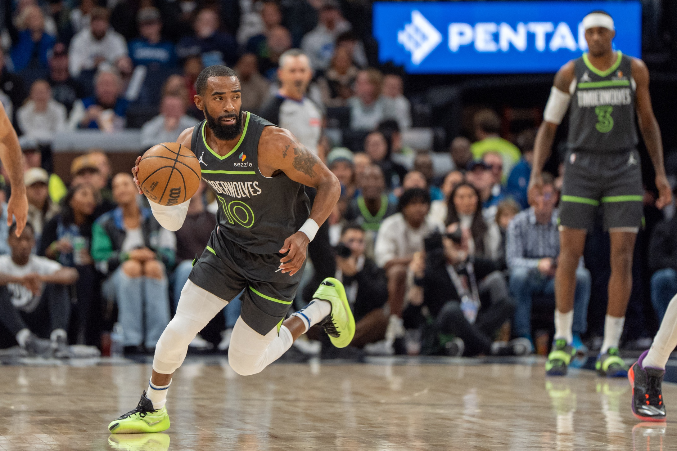 Nov 1, 2024; Minneapolis, Minnesota, USA; Minnesota Timberwolves guard Mike Conley (10) steals the ball from Denver Nuggets guard Christian Braun (0) in the first quarter at Target Center. Mandatory Credit: Matt Blewett-Imagn Images