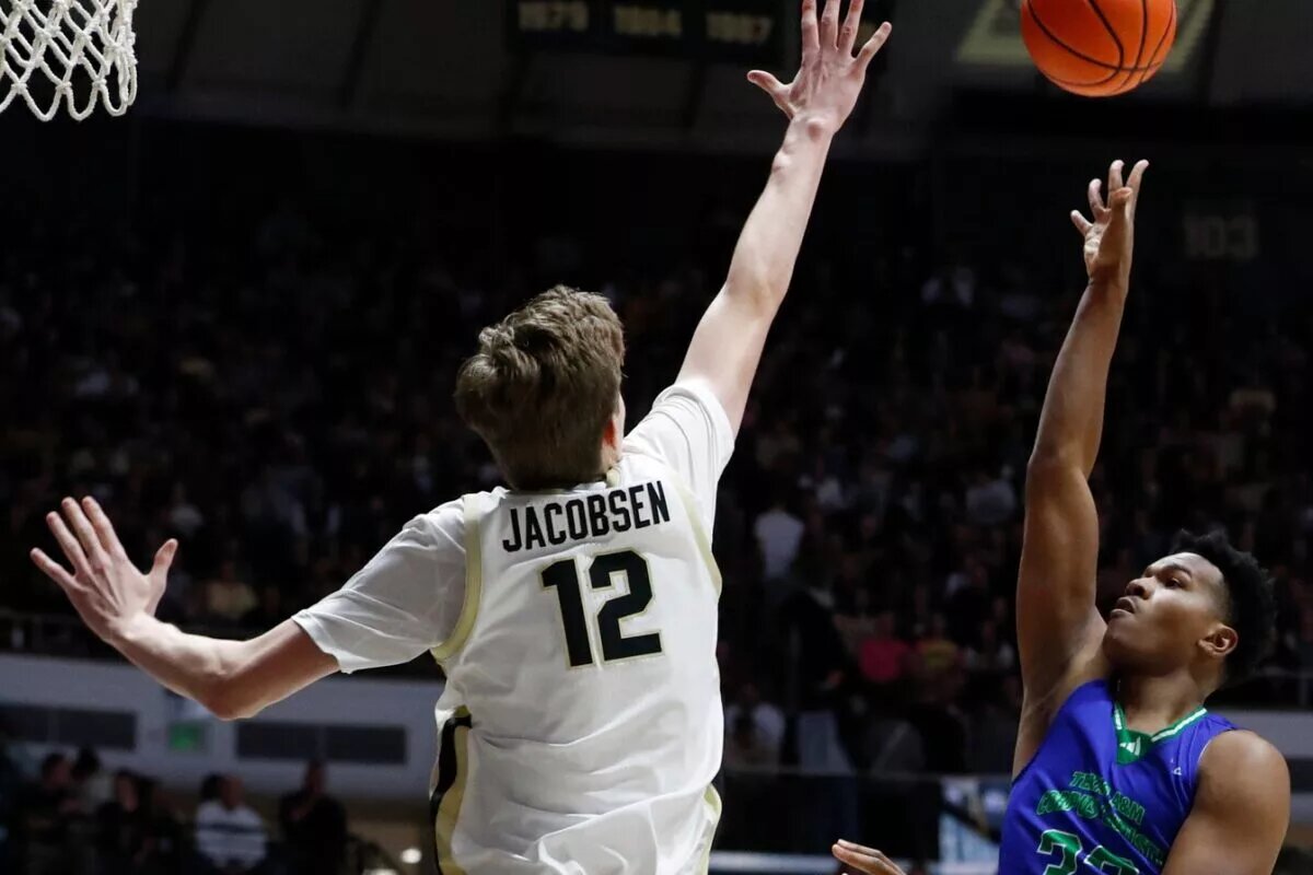 Purdue Boilermakers center Daniel Jacobsen (12) defends the shot of Texas A&M-CC Islanders forward Garry Clark (33) Monday, Nov. 4, 2024, during the NCAA men’s basketball game at Mackey Arena in West Lafayette, Ind.