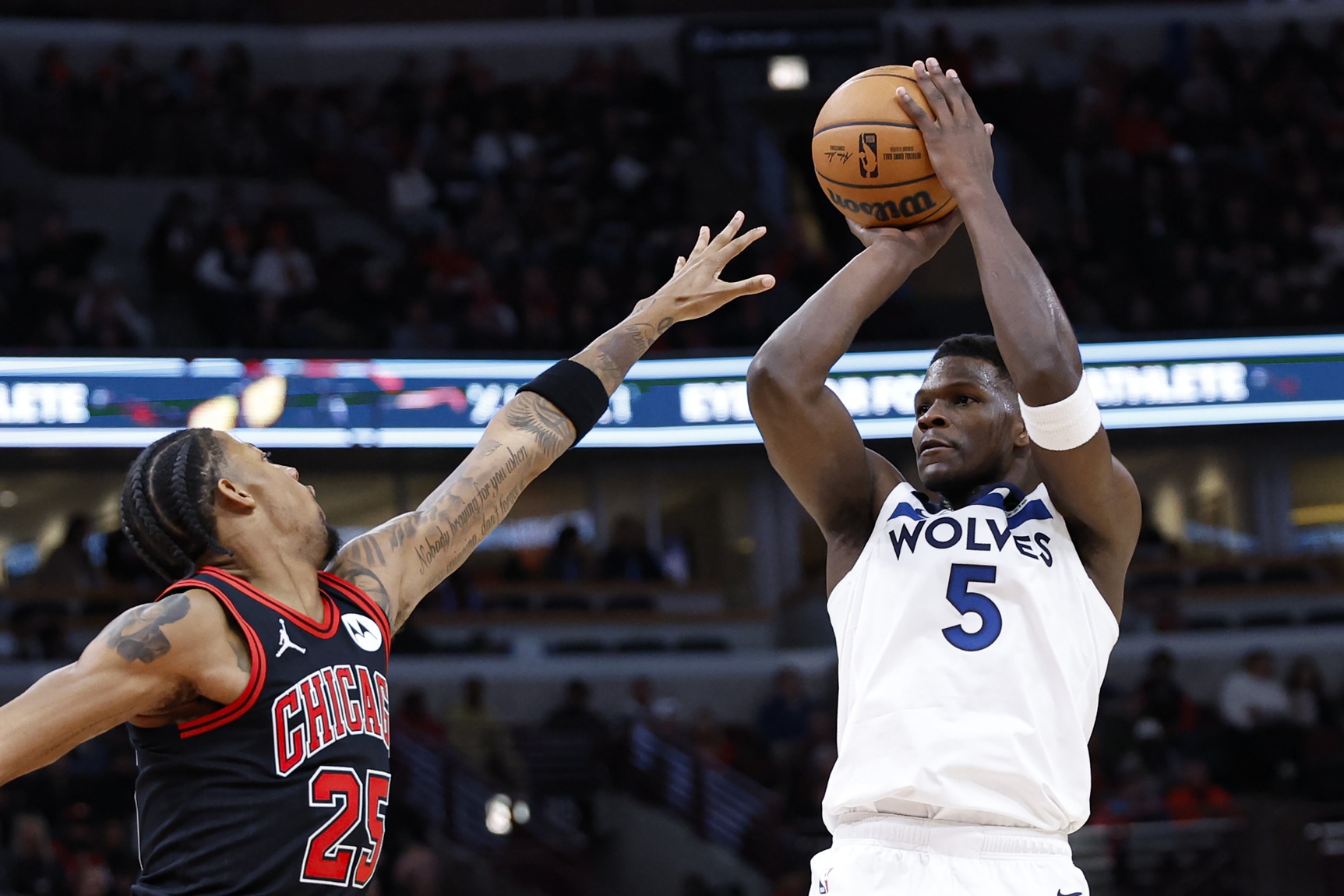 Nov 7, 2024; Chicago, Illinois, USA; Minnesota Timberwolves guard Anthony Edwards (5) shoots against Chicago Bulls forward Dalen Terry (25) during the first half at United Center. Mandatory Credit: Kamil Krzaczynski-Imagn Images